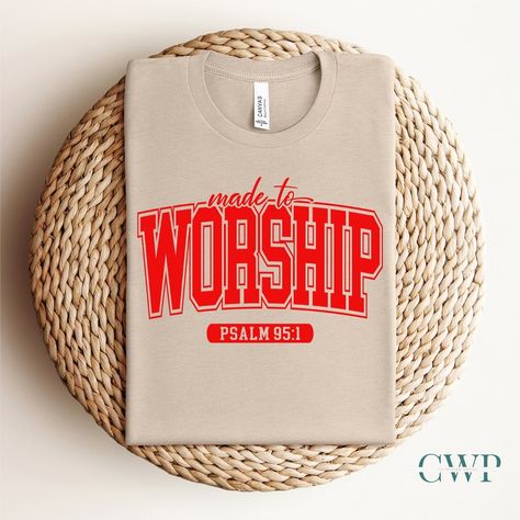 New Drop Alert Made To Worship Psalms 95:1. This tee is more than fabric; it’s a reminder that your purpose is to dance in the rhythm of worship, echoing the verses of Psalms 95:1. Let your heart sing, for you are beautifully made to worship. 🌟👕 #faithbasedapparel #faithbasedtshirts #faithbasedbusiness #christianstreetwear #christianclothing #madetoworship #womanofgod #womanoffaith Praise And Worship Team Shirts, Worship Team Shirts, Church Tshirt Designs, Christian Tshirt Design Ideas, Worship Shirts, Faith T Shirts, Church Shirt Designs, Church Tshirts, Faith Tshirts