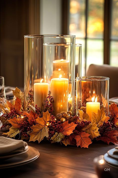 Elegant fall centerpiece with glowing candles, surrounded by autumn leaves, berries, and acorns. Perfect for cozy fall home decor. Thanksgiving Decorations For Living Room, Fall Candle Sticks, No Pumpkin Fall Decor, Thanksgiving Decorating Ideas Diy, Entryway Fall Decor Ideas, Decorating For Fall Ideas, Fall Candle Ideas, Thanksgiving Ideas Decorating, Thanks Giving Decor