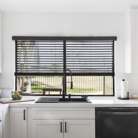 Grey Textured Faux Wood Blinds above a kitchen sink Book a Free In Home Consultation to learn more. Beige Blinds, Textured Window Treatments, 3 Day Blinds, Kitchen With White Cabinets, Vinyl Blinds, Cellular Blinds, Blinds Window, Blinds And Shades, Motorized Blinds