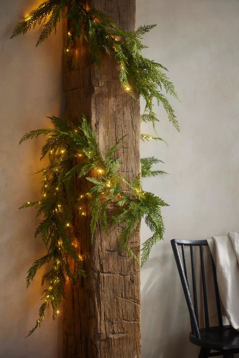 Pre-Lit Faux Cedar Garland, Evergreen | Anthropologie Realistic Garland, Evergreen Wall, Faux Cedar Garland, Cedar Boughs, Pottery Barn Lighting, Cedar Garland, Christmas Nature, Winter Ball, Pine Garland