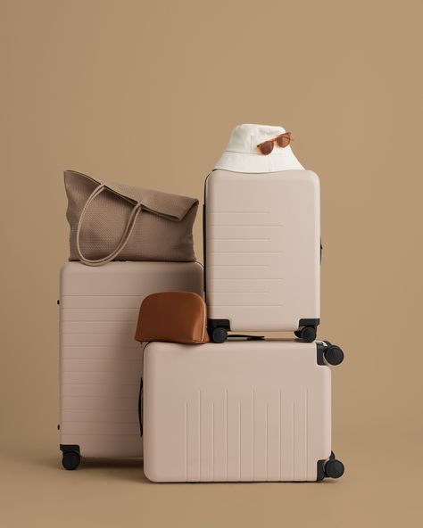 Ready to have your smoothest home-for-the-holidays experience ever? No guarantees on getting along with your sister, but we can promise that the Japanese-crafted, 360-degree wheels on our ultra-light suitcases will help while you’re en route. Mix and match our beige and tan bags to keep your color palette tight. Luggage Product Photography, Travel Props, Suitcase Photography, Organized Minimalist, Luggage Photography, Neoprene Backpack, Preppy Travel, Luxury Travel Bag, Photography Bags