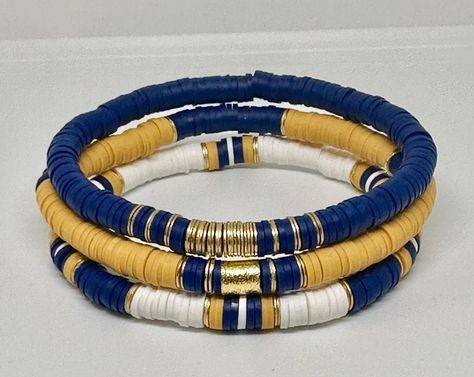 Navy and Mustard Yellow bracelet set, beaded bracelets, stacking bracelets, Boho bracelets, preppy bracelets, womens gift, custom bracelets by StackEmByShae on Etsy Blue Heishi Bracelet, Heishi Bracelet Ideas, Lara Craft, Bracelets Preppy, Bracelets Stacking, Fimo Jewelry, Preppy Bracelets, Bracelets Boho, Yellow Bracelet