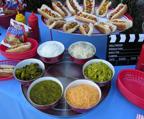 Create a topping bar for hot dogs so guests can make their own favorite style dog. Movie Outdoor, Outdoor Movie Night Party, Backyard Party Food, Outdoor Movie Party, Backyard Movie Party, Outdoor Movie Night, Movie Night Birthday Party, Movie Birthday Party, Backyard Movie Nights