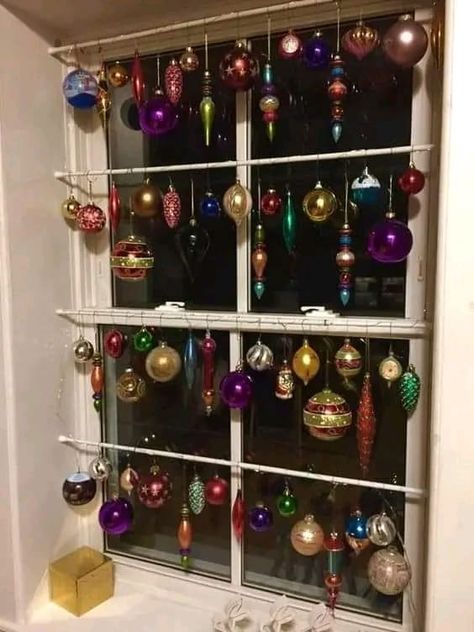 Window Ornaments Ideas, Ornaments Hanging In Window, Hanging Ornaments In Windows, Ornaments In Window, Ways To Display Christmas Ornaments, Window Garland Christmas, Window Decoration Ideas, Window Garland, Merry Chrysler