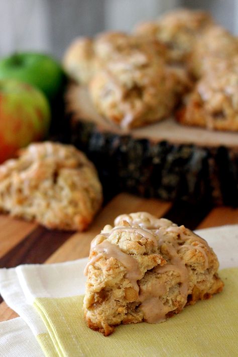 Spiced Apple Scones with Apple Cider Glaze. This time of year pumpkin usually gets all of the attention, these spicy sweet apple scones are enough to make you forget about pumpkin altogether. The tart apples are spiced up with cinnamon, ginger, nutmeg and cider then wrapped in a buttery blanket of crumbly dough. Apple Cider Glaze, Apple Scones, Apple Cider Recipe, Apple Spice, Egg Roll, Glaze Recipe, Scone Recipe, Spiced Apples, Fall Baking