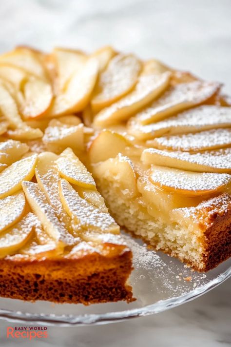 This moist and dense German Apple Cake is a family favorite, featuring tender apples and a soft, spiced cake. Topped with a dusting of confectioners' sugar, it’s a perfect dessert for fall baking or any occasion. German Dessert Recipes, German Apple Cake Recipe, German Cakes Recipes, Traditional German Desserts, German Dessert, Dessert For Fall, German Apple Cake, Spiced Cake, German Food Authentic