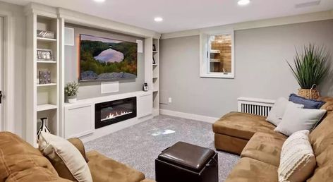 Low ceilings in your basement? Try these solutions - Design Morsels Low Ceiling Tv Wall, Fireplace In Basement Family Room, Small Basement Remodel Low Ceilings Decorating Ideas, Basement Fireplace With Low Ceiling, Basement Living Room Ideas Low Ceilings, Small Basement Remodel Low Ceilings, Low Ceiling Living Room, Large Tv Wall Ideas Living Room, Basement Color Schemes