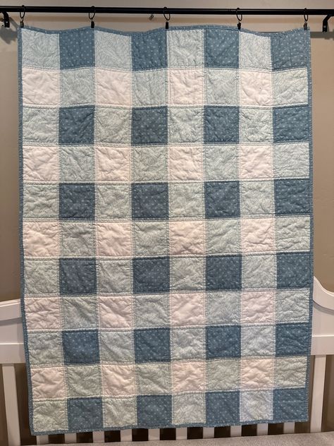 "This handmade Gingham quilt is the perfect companion to the Snowflake baby quilt. It measures 38\" x 53\" the best size for a toddler to cozy up with. You could also use this quilt as a playpad. Made with the same fabrics as the Snowflake quilt it matches perfectly. Made from light blue, aqua, and off-white 100% cotton fabrics. The backing is a beautiful gray and aqua paisley. Pictured with a coordinating Toddler-size pillowcase. Receive Free Shipping if ordered at the same time as the quilt. Please alert me of the add-on by putting a note in the order. Wouldn't a big brother or sister just love to receive a quilt to match their new baby's quilt? 100% cotton fabric with Warm & White batting.   All quilts are pre-washed before shipping to ensure colorfastness and softness. Machine quilted Quilting Designs Patterns Ideas Simple, Boy Baby Blanket Quilt, Boy Quilts Ideas, Gingham Quilt Pattern Free, Baby Boy Quilts Ideas, Quilted Baby Blanket Patterns Boys, Quilts With Gingham Fabric, Gingham Foundry Quilt, Modern Baby Quilt Patterns