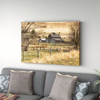 This Roadside Barn by Ramona Murdock - Print on Canvas captures a weathered brown barn nestled beside classic picket fences and a wide-open landscape, for a touch of farmhouse flair in your home. Designed by Ramona Murdock, this oil painting print adds a rustic look with its splashes of green, beige, and gray tones. It's printed on a cotton canvas and wrapped over wooden bars. Plus, it's also ready to hang from the frame, no hardware is needed. This print is a welcome addition to any bedroom, de Farm Wall Art, Farmhouse Paintings, Picket Fences, Farmhouse Flair, Beautiful Oil Paintings, Rural Landscape, Farmhouse Wall Art, Old Farm, Floater Frame