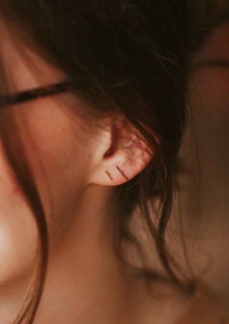 Gold bar stud earrings styled in an ear with tiniest bar studs by Hello Adorn. Poppy Ring, Simple Studs, Twist Earrings, Horseshoe Earrings, Bolo Necklace, Everyday Wear Jewelry, Earring Sets, Mini Collection, Triangle Studs