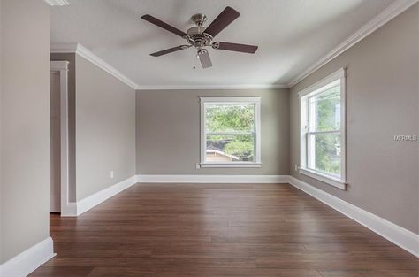 Grey walls, white trim, warm brown floors. Floors With Grey Walls, Grey Staircase, Grey Stairs, Staircase White, Grey Walls White Trim, Stairs Painted, Wood Floor Stain Colors, Grey Wall Tiles, Brown Living Room Decor