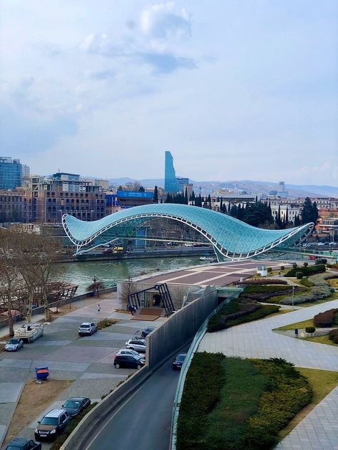 Bridge of Peace, pedestrian bridge across Kura River | Tbilisi, Republic of Georgia | Designed by Italian architect Michele De Lucchi | Opened 2010 | 150 meters/1/10th mile long Bridge Of Peace Tbilisi, Meditation Hall, Peace Bridge, Republic Of Georgia, Aesthetic Core, Invitation Video, Wedding Invitation Video, Pedestrian Bridge, Structure Design