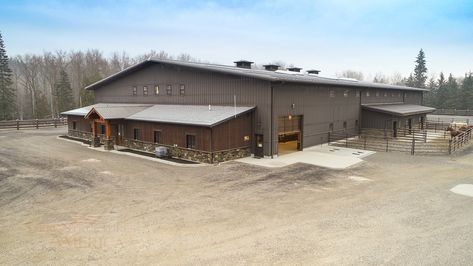 The Perfect Equestrian Barn & Riding Arena This 70’x108’x16′ arena with 52’x48’x14′ barn area is perfect for any level rider. The siding is a beautiful stained cedar board and batten with custom built sliding doors featuring a crossbuck design. There are (6) 12×12 stalls, powder coated black and lined with 2×6 T&G. They roof has 2′ overhangs and (3) 48″ cupolas for added ventilation. This structure will provide many years of fun and enjoyment for family and friends. Stained Cedar, Cedar Board, Equestrian Barns, Farm Property, Riding Arena, Horse Arena, Cedar Boards, Riding Arenas, Farm Projects