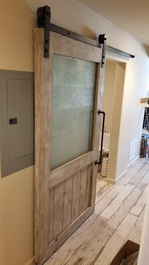 Sliding Barn Door With Window, Barn Door With Glass Panels, Barn Door With Glass, Industrial Barn Door, Glass Barn Doors Interior, Brick Bathroom, Barnwood Doors, Log Home Kitchens, Double Sliding Barn Doors