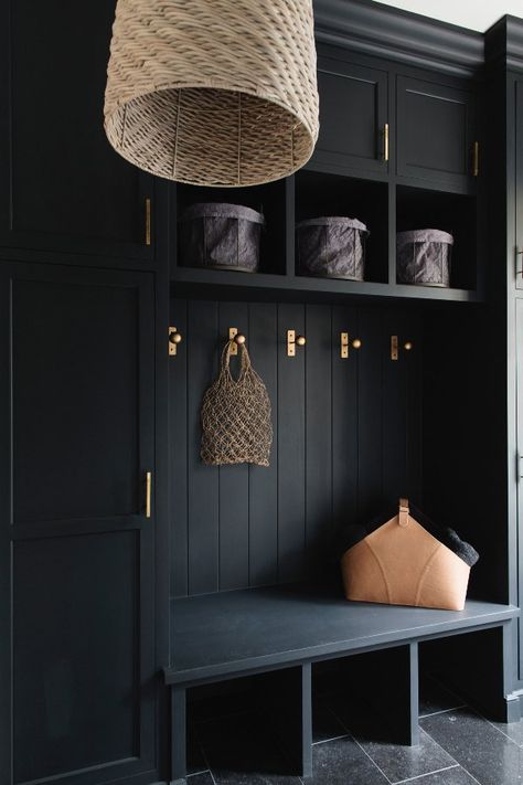 A mudroom entryway is taken to the next level with sumptuous black paint and brass hardware, while linen, leather and woven accents lend a lived-in warmth. Image: Graham Yelton Mudroom Remodel, Mudroom Cabinets, Mud Room Entry, Mudroom Entryway, Mudroom Decor, Mudroom Laundry Room, Mud Room Storage, Mudroom Design, Hallway Designs