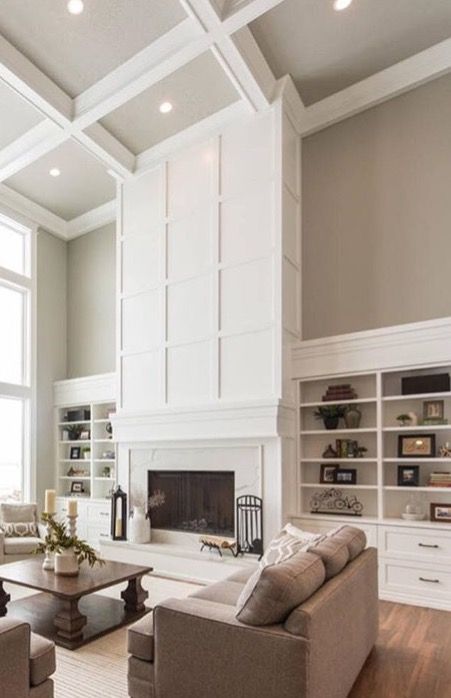 Board And Batten Two Story Fireplace, 2 Story Coffered Ceiling, 2 Story Built Ins, Lighting Two Story Family Room, Built In Shelves 2 Story Living Room, Built Ins Around Fireplace Tall Ceilings, Built In Media Wall High Ceiling, Fireplace In Tall Living Room, White Tall Fireplace