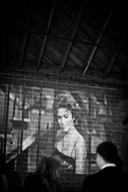 This inspired me - have a black and white film playing on the wall of the b and g talking about each other for those guests interested about "their story," etc. Black And White Movie Party, Projector On Wall, Wedding Projector, Projector Party, Old Hollywood Prom, Old Hollywood Party, Hollywood Prom, Film Projection, Old Hollywood Theme