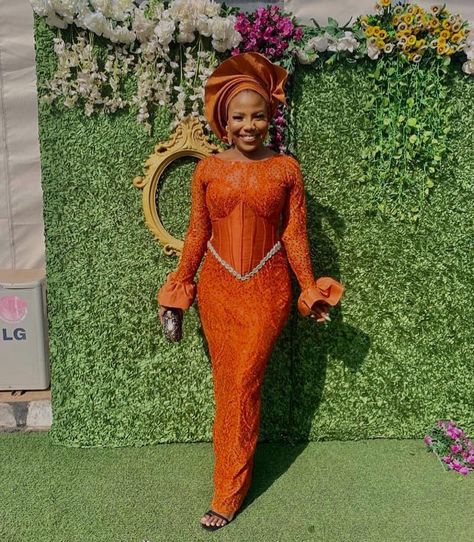 AsoebiAfrica® on Instagram: “Wedding guest @iampwetti_cece 🧡 Dress @krishclothing_” Orange African Dress, Burnt Orange Lace Dress, Lace Asoebi Styles, Owambe Styles, Lace Styles For Wedding, African Couture, Aso Ebi Lace Styles, Orange Lace Dress, African Bridesmaid Dresses