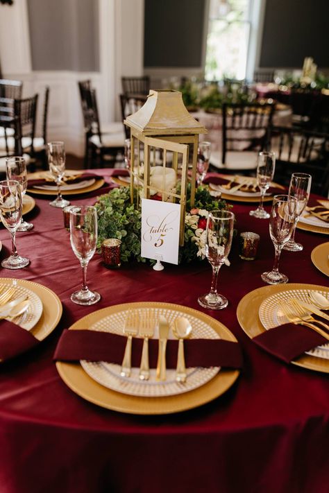 Venue: Richwood on the River | Burgundy wedding table setting; gold accents; burgundy and gold wedding; centerpieces. Burgundy Cream And Gold Wedding Decor, Terracotta Burgundy Gold Wedding, Maroon White Gold Wedding, Burgundy Gold Table Setting, Cabernet And Gold Wedding, Burgundy Decorations Quinceanera, Red White And Gold Wedding Centerpieces, Burgundy And Gold Table Setting, Burgandy Wedding Centerpieces