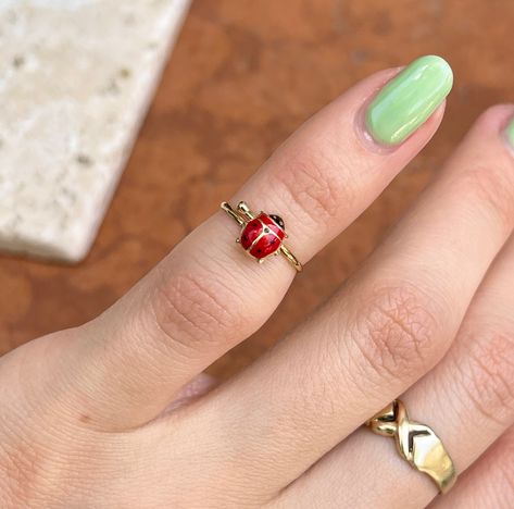 14KT yellow gold red ladybug youth size ring. This is a YOUTH size ring that is also adjustable to fit a number of child/ baby sizes. For adults this ring would be a midi ring (as shown in photo). Size 1.5 and stretches to size 3 Weight: .59 gram Band width: 1.17mm One size only; adjustable Solid 14K Minimal Rings Gold, Ladybug Accessories, Blueberry Emoji, Ladybug Ring, Cool Rings, Ladybug Jewelry, Dope Jewelry Accessories, Funky Rings, Fantasy Earrings