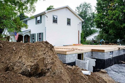 The cost to dig out a basement, whether for a new home, crawl space conversion, or full basement expansion, can yield an impressive return on investment. Waterproofing Basement Walls, Basement Addition, Building A Basement, Pool Water Features, Room Addition, Building Remodeling, Waterproofing Basement, Small Basements, Basement Walls