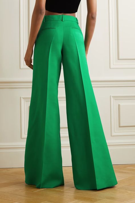 VALENTINO Pleated wool and silk-blend crepe wide-leg pants. Color: Green US$2,441.86 Valentino's use of color instantly elevates wardrobe staples like these pants. They have been tailored in Italy from bright-green wool and silk-blend crepe and have an especially wide-leg silhouette accentuated by sharp pressed creases, which make them even more impactful. Fits true to size, take your normal size High-rise, cut for a slim fit with a flared hem Mid-weight, non-stretchy fabric Model is 177cm/ 5' Plain Pants, Valentino Clothing, Wide Leg Palazzo Pants, Flared Trousers, Stylish Pants, Trousers Pants, Flare Trousers, Green Pants, Casual Office