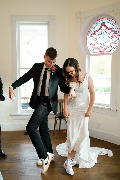 Take a stylish step together with matching wedding shoes for the bride and groom! 👟💕 Dive into the charming detail of Galen and James swapping into coordinating sneakers for their reception at The Grand Lady. Perfect for couples who want to dance the night away in comfort and style. Explore our photos for inspiration on how to personalize your wedding with a fun shoe change! 🕺💃 #MatchingWeddingShoes #WeddingStyle #BrideGroomShoes #WeddingDetails Bride And Groom Wearing Jordans, Matching Sneakers Wedding, Bride And Groom Matching Shoes, Wedding Sneakers For Bride And Groom, Wedding Sneakers For Bride, Bride Sneakers, Wedding Sneakers, Austin Wedding Venues, Groom Shoes