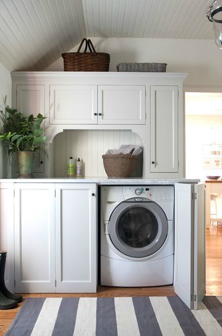 Sage Design - laundry/mud rooms - folding doors, folding cabinet doors, hidden washer and dryer, concealed washer and dryer, beadboard ceili... Rustic Farmhouse Laundry Room, White Laundry Room, Cottage Laundry Room, Queenslander Homes, Hidden Laundry, Laundry Room/mud Room, White Laundry, Mudroom Laundry Room, Farmhouse Laundry