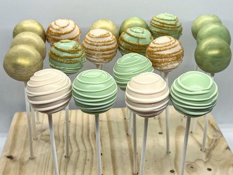 Gold And Green Theme Party, Green And Gold Gender Reveal Party, Sage Green And Gold Cake Pops, Light Green Cake Pops, Princess Tiana Desserts, Sage Green And Gold Dessert Table, Sage Green And White Cake Pops, Green Candy Table Ideas, Forest Green Dessert Table