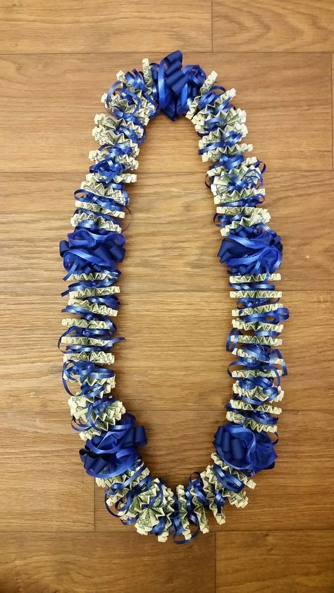 Royal blue ribbon, traditional fan fold, closed money lei Senior Money Necklace, Graduation Money Lei For Boys, Money Leis For Graduation Diy For Boys, Grad Lays, Graduation Lay, Dollar Lei, Oragami Money, Graduations Ideas, Money Gifting