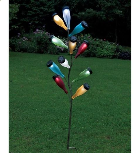 bottle tree with solar lights... so clever Diy Path, Solar Light Crafts, Diy Outdoor Lighting, Bottle Trees, Bottle Tree, Metal Tree Wall Art, Lawn Ornaments, Light Crafts, Metal Bottles