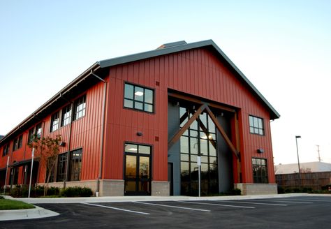 Board and Batten exterior finish with standing seam roof, commercial storefront and exposed wood structural elements create an Annapolis twist on a Pacific Northwest American look. This 2 story office building is set up to be for mix of Office and Retail end users. Warehouse Business Ideas, Modern Warehouse Design Exterior, Warehouse Aesthetic, Commercial Steel Buildings, Hobby Garage, Board And Batten Exterior, Metal Building Designs, Factory Architecture, Commercial And Office Architecture