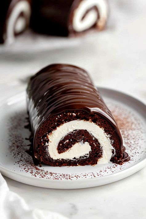 Chocolate Swiss roll cake is a decadent delight, combining rich, moist chocolate sponge cake with a velvety, creamy filling. Each bite offers a perfect balance of cocoa flavor and smooth sweetness. Swiss Cake, Chocolate Swiss Roll, Chocolate Roll Cake, Yule Log Cake, Swiss Roll Cake, Ganache Cake, Cake Roll Recipes, Chocolate Sponge Cake, Log Cake