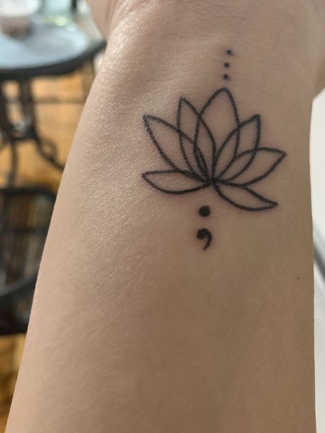 Lotus flower with semi-colon :) | Small lotus flower ... #smalltattoo #tattooideas Lotus Tattoo Wrist, Lotus Flower Tattoo Wrist, Simple Lotus Flower Tattoo, Lotus Tattoo Meaning, Lotus Flower Tattoo Meaning, Small Wrist Tattoo, Lotusblume Tattoo, Small Lotus Flower Tattoo, Small Lotus Tattoo