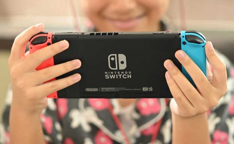 The 8 Best Nintendo Switch Games The Entire Family Will Love - Filter Free Parents Holding Switch Reference, Person Playing Nintendo Switch Pose, Holding Nintendo Switch Reference, Playing Nintendo Switch Pose Reference, Nintendo Switch Drawing, Playing Nintendo Switch Pose, Mario Party Games, Good Fried Chicken, Thanksgiving Candy