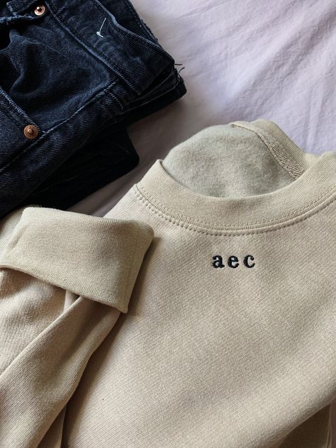 Placed thoughtfully along the right side of the collar, you (or the lucky recipient) will love the modest and classic serif initials on this comfy, crewneck sweatshirt.  Purchasing more than one? Use MOERTHANONE at check out for 10% off.  *Pictured is sand sweatshirt with black thread Features ○ 80/20 Cotton & Polyester ○ Unisex Sizing ○ Eco Shipping Crewneck Design Ideas, Bridesmaid Sweatshirts, Initial Sweatshirt, Simple Sweatshirt, Monogram Sweatshirt, Wedding Party Gifts, Embroidered Initials, Gifts Bridesmaid, Pumpkin Sweatshirts