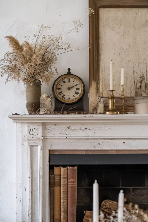 Cozy autumn mantel decor includes vintage clock, dried floral arrangement, candles, and books. Perfect inspiration for fall fireplace décor ideas. Old Fireplace Decor, Vintage Fireplace Mantle Decor, Country Mantle Decor, Faux Vintage Fireplace Mantle, Fall Decor For Fireplace, Hearth Decorations, Mantle With Tv Decorating Ideas, Vintage Mantle Decor, Antique Mantle Fireplace Wood