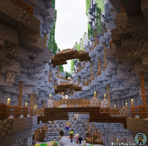 Minecraft Canyon Ideas, Hanging Cave House Minecraft, Minecraft Lush Caves Village, Minecraft Cave Bridge Ideas, Cave Side Minecraft House, Fantasy Mega Base Minecraft, Minecraft Cave Village Ideas, Minecraft Cave Bridge, Ravine Village Minecraft