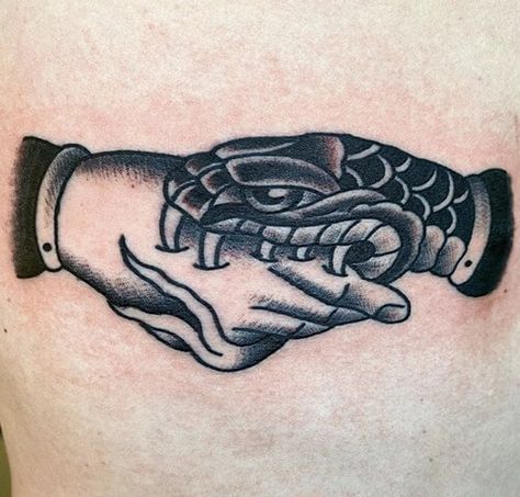 15+ Handshake Tattoo Designs: The Hand That Bites Tattoo | PetPress Snake Bite Tattoo, Handshake Tattoo, Bite Tattoo, Tattoos Behind Ear, Snake Bite, Snake Bites, Hand Tattoos For Guys, Tattoo Meaning, Hand Tattoo