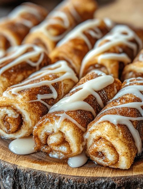 Picture waking up to the enticing aroma of spiced cinnamon and sugary sweetness wafting through your kitchen. Cinnamon Roll French Toast Roll-Ups are not just breakfast; they're an experience! Fluffy bread filled with a rich cinnamon-sugar mixture, fried until golden, and drizzled with maple syrup and possibly even cream cheese frosting. This dish transforms your typical morning routine into a... Cinnamon Roll Bread Twists, Honey Cinnamon Rollups Taste Of Home, Bacon Cinnamon Roll Twists, Cinnamon Drizzle, Bread Twist, Breakfast Ring, Bread Twists, Cinnamon Roll French, Cinnamon Roll French Toast