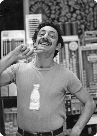 Harvey Milk wears a milk bottle t-shirt in his Castro Camera store (1975) via Harvey Milk Archives, Gay & Lesbian Center, San Francisco Public Library | Photo: From 'Double Play', by Mike Weiss Lgbt Culture, Harvey Milk, Lgbt History, Living In San Francisco, Happy Pride, Historical Photos, Human Rights, Documentaries, San Francisco