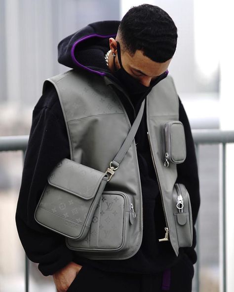 LOUIS VUITTON CLUB on Instagram: ““Cut up a Titanium Kim Jones LV Bag and made a Utility Vest and a Ammo Lanyard. Tag someone who should see this.” - @SheronBarber…” Utility Vest Outerwear For Streetwear, Utility Style Vest With Functional Pockets For Streetwear, Urban Streetwear Vest With Side Pockets, Luxury Functional Streetwear Bags, Utility Vest Outfit Men, Utility Vest For Streetwear, Utility Vest Outfit, Fashion Cyberpunk, Utility Wear