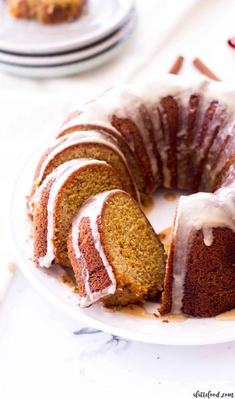 This easy Vanilla Pumpkin Bundt Cake recipe is topped with a maple glaze (aka maple icing). Homemade pumpkin cake is swirled with vanilla cake to make a vanilla pumpkin spice cake that is to die for. This pumpkin vanilla bundt cake is made from scratch (no cake mix required) and is made in one bowl. An easy fall dessert! #pumpkin #vanilla #cake #recipe #dessert Pumpkin Cake Filling, Holiday Baking Treats, Pumpkin Bundt Cake Recipes, Maple Icing, Baked Apple Dessert, Pumpkin Rolls, Pumpkin Bundt, Pumpkin Rolls Recipe, Desserts Party