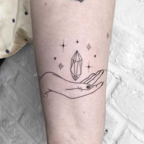 Hand-poked hand and crystal tattoo on the left arm Crystal Tattoos, Minimalist Tattoo Meaning, Tiny Tattoos For Women, Paris Tattoo, Typography Tattoo, Astrology Tattoo, Crystal Tattoo, Hand Poked Tattoo, Tattoo Portfolio