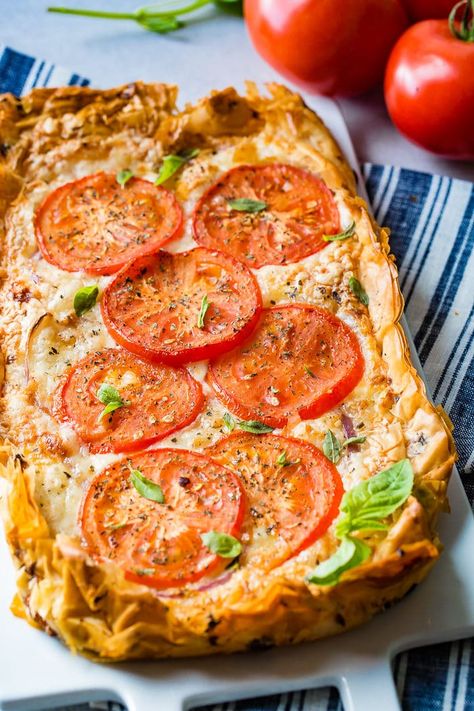 This Rustic Tomato Tart is even more wildly delicious than it looks. It's one of my absolute favorite things to make for entertaining because it looks extra fancy! I also find myself craving it on slow summer days when my garden is bursting with ripe tomatoes! #tomatoes #appetizer #vegetarian #filo #tart Phyllo Tomato Tart, Rustic Tomato Tart, Filo Pastry Recipes Savoury, Vegetable Tarts, Appetizer Vegetarian, Hot Lunches, Rustic Tart, Filo Pastry Recipes, Filo Pie