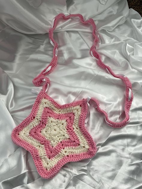 Our crochet star bag comes in many different colors to choose from along with adding an optional side panel! Each bag has ribbon woven into the straps to make them adjustable to any length! Please note when ordering: the primary color is the color of the strap. Because each bag is made to order, shipping  can take anywhere from 2-4 weeks. Please be patient with us (: Crochet Inspo Bag, Crochet Bag Star, Crochet Bag Straps, Crochet Star Bag, Crochet Bag Strap, Start Crochet, Crochet Strap, Star Bag, Crochet Star