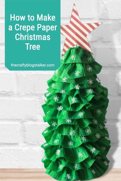 This Crepe Paper Christmas Tree is a fun and beautiful way to decorate for the Christmas season. Learn how to make a crepe-paper Christmas tree here. #thecraftyblogstalker #cricutornaments #christmasornaments personalized Curled Paper Christmas Tree, Crepe Paper Christmas Decorations, Crepe Paper Christmas Flowers, Crepe Paper Christmas Tree, Crepe Paper Holly, Crepe Paper Christmas, Pinterest Christmas Crafts, Cardboard Christmas Tree, Pinterest Christmas