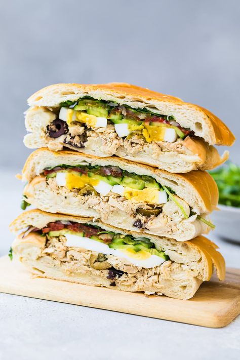 The Pan Bagnat is a protein-packed tuna sandwich from Nice, France. It’s like a handheld Salade Niçoise only without the potatoes and perfect for picnics or a make-ahead lunch! #sandwich #cannedtuna #picnic #easyrecipes #highprotein Skinnytaste Lunch, Party Subs, Sandwich Platters, Sandwich Club, Hard Boiled Egg Recipes, Vegan Paleo Recipes, Tuna Sandwich, Lunch Appetizers, Skinnytaste Recipes