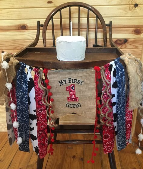 "NEW COLOR BANDANA LISTING ADDED! BRIGHT RED BANDANA FABRIC! THIS BANNER IS EMBROIDERED WITH THESE SAYINGS ONLY: \"My First Birthday/My First Rodeo\" OR Personalized(Name) Birthday/Personalized (Name) Rodeo. Please check out the listings below of my other similar Cowboy/Rodeo Banners that are PERSONLIZED for your child's name. PLEASE NOTE: FUZZY WHITE POM POMS FEATURED ON THE END OF THE BANNERS ARE DISCONTINUED BY THE YARN COMPANY AND I HAVE DEPLETED MY STOCK OF THEM. AN ACCEPTABLE SUBSTITUTION First Rodeo Birthday, Rodeo Birthday Parties, My First Birthday, Rodeo Party, Custom Birthday Banners, Birthday Highchair, My First Rodeo, Rodeo Birthday, First Rodeo