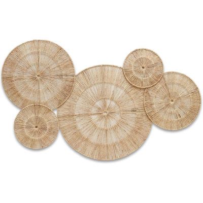 The light brown shade of these wall hangings creates a calm & pleasing atmosphere. With a circular sunburst pattern, they have a simple yet elegant texture that can create a focal point among your interiors. | Bayou Breeze 5 Wall Decor Set 42.0 W x 23.0 D in Brown | Wayfair | Home Decor Wicker Wall Art, Boho Hanging Lights, Ceiling Alcove, Large Rattan Wall Art, Wicker Basket Wall Art, Round Woven Wall Decor, Wicker Circle Wall Decor, Boho Basket Wall Art Woven, Rattan Shell Wall Decor